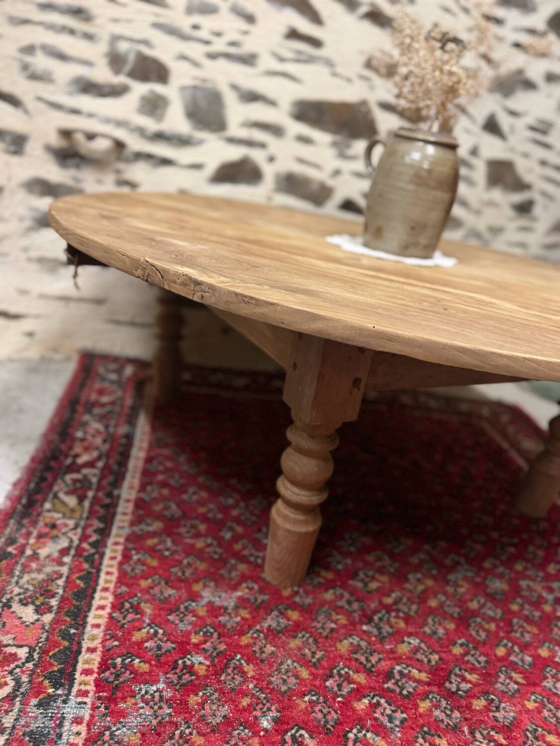 Oval coffee table in raw wood