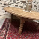 Oval coffee table in raw wood