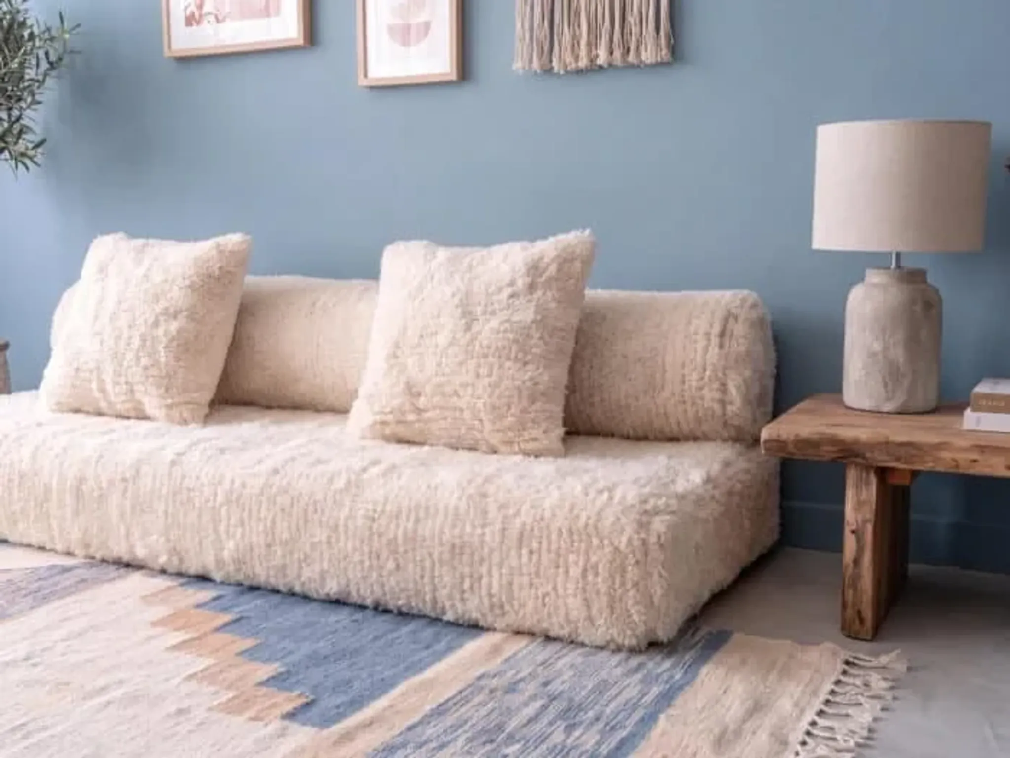 White Moroccan Arabic sofa with a rounded backrest.