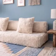 White Moroccan Arabic sofa with a rounded backrest.
