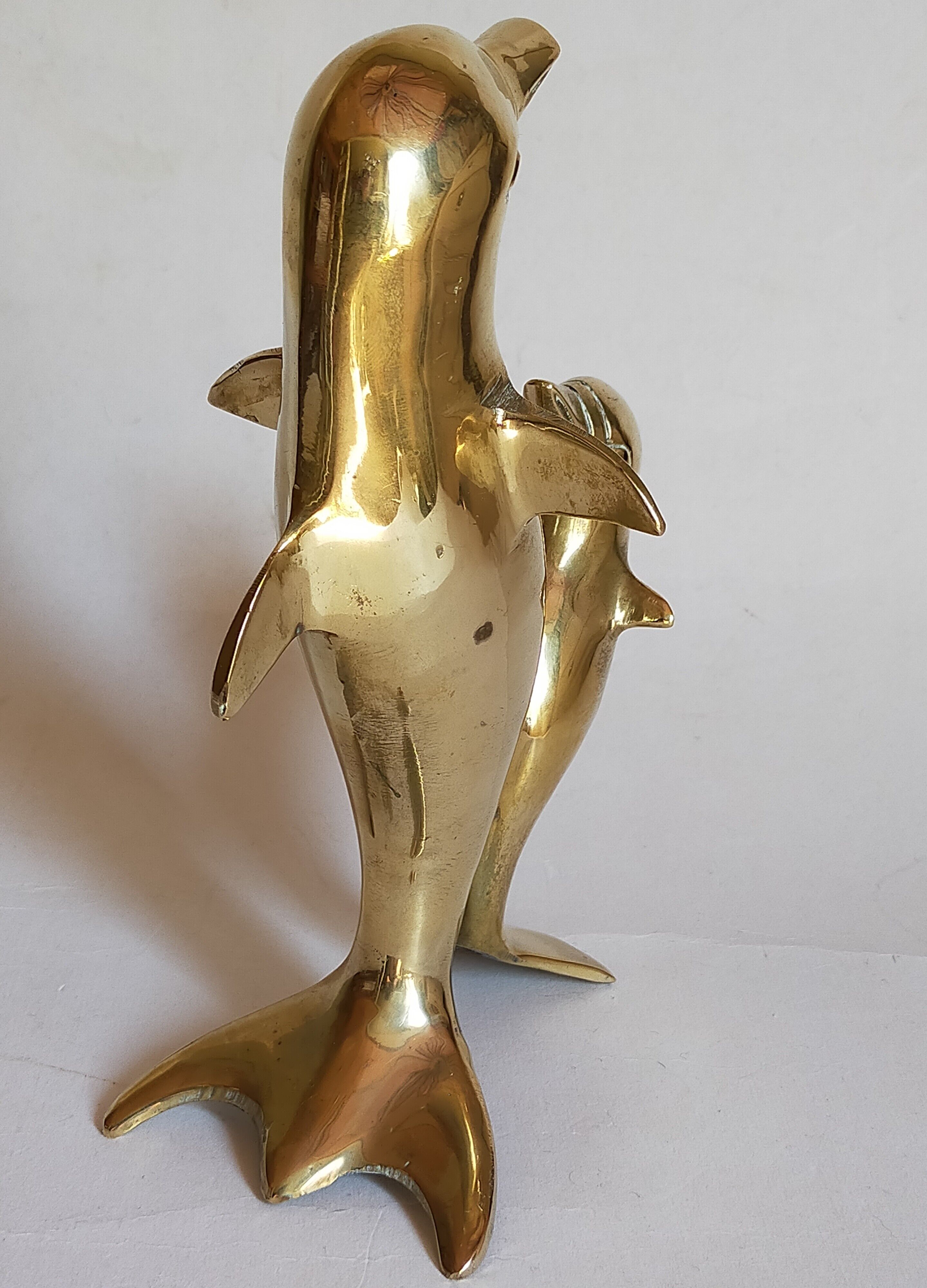 Vintage solid brass dolphins