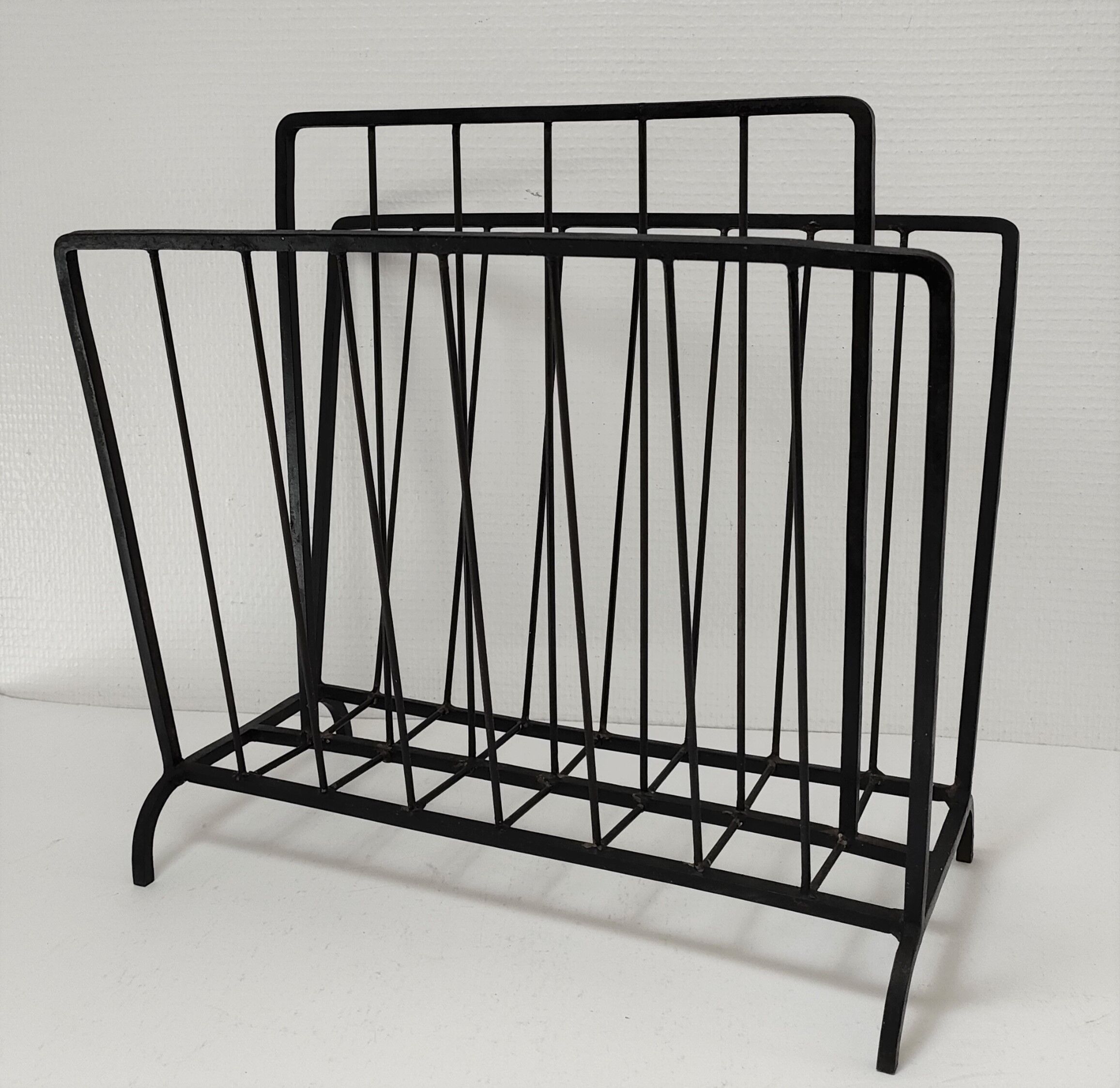 Modernist magazine holder black iron 60s