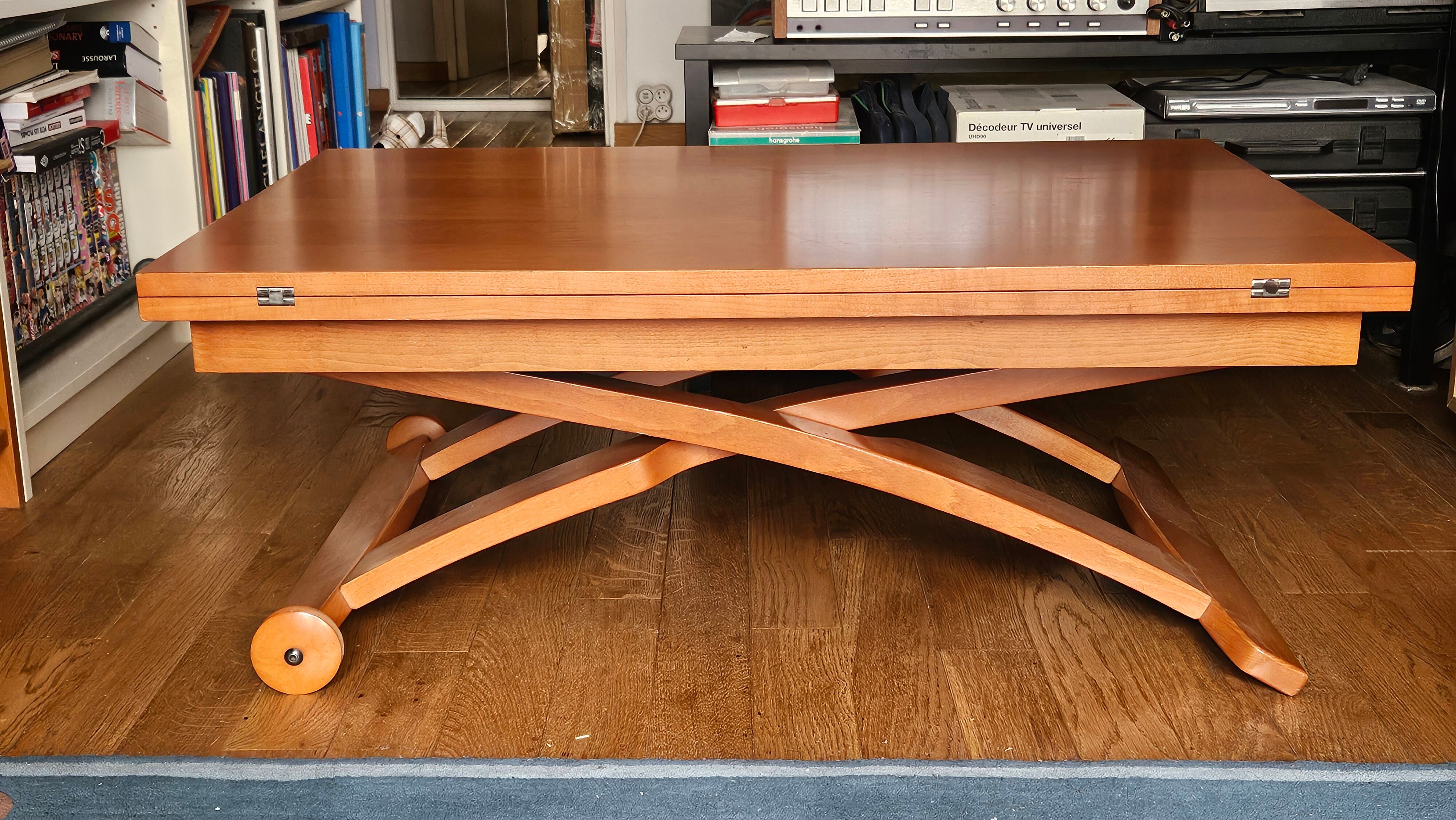 Wooden coffee table convertible into a dining table.