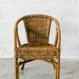 Rattan armchair with armrests