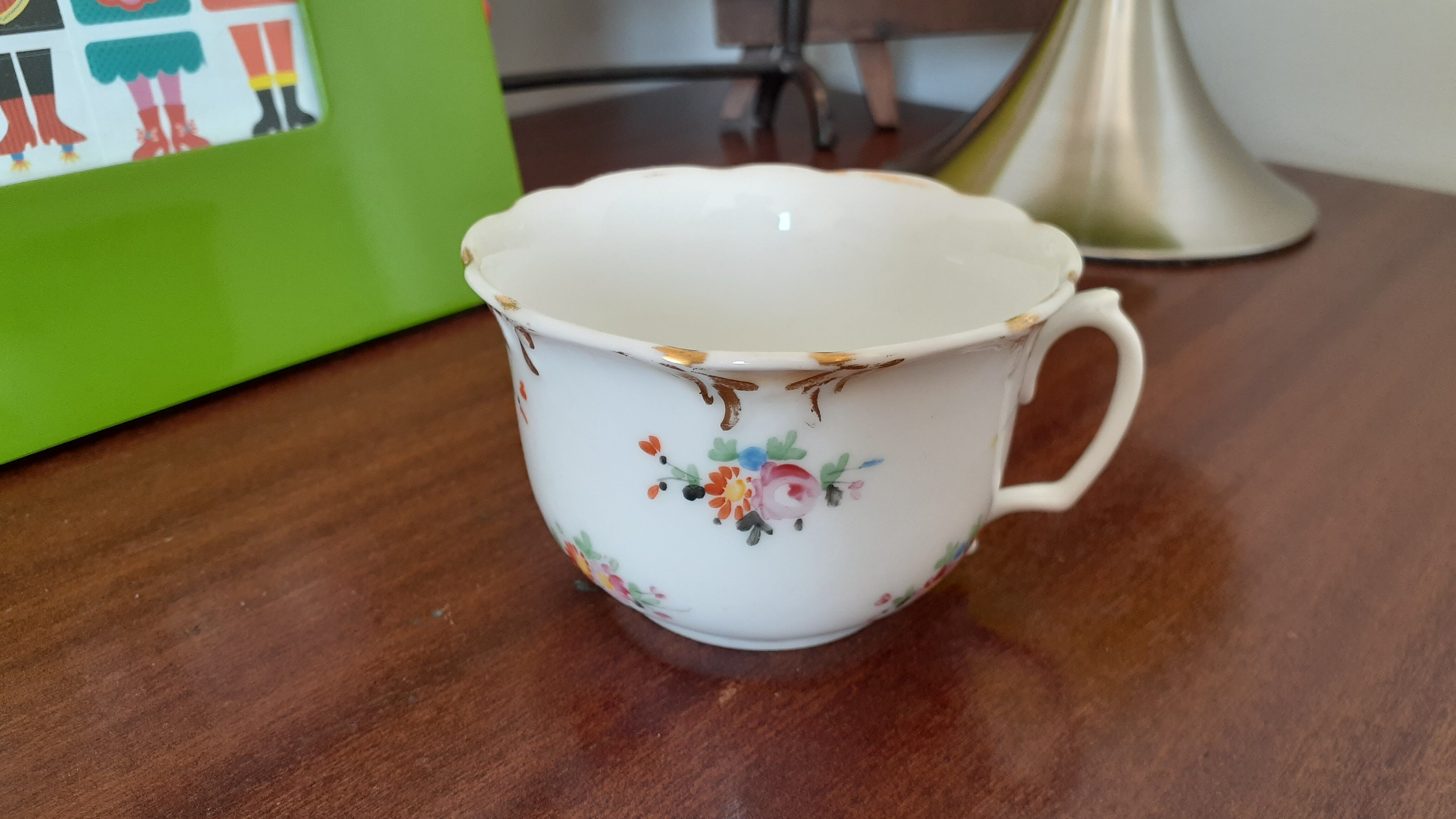 Antique flowered porcelain cup