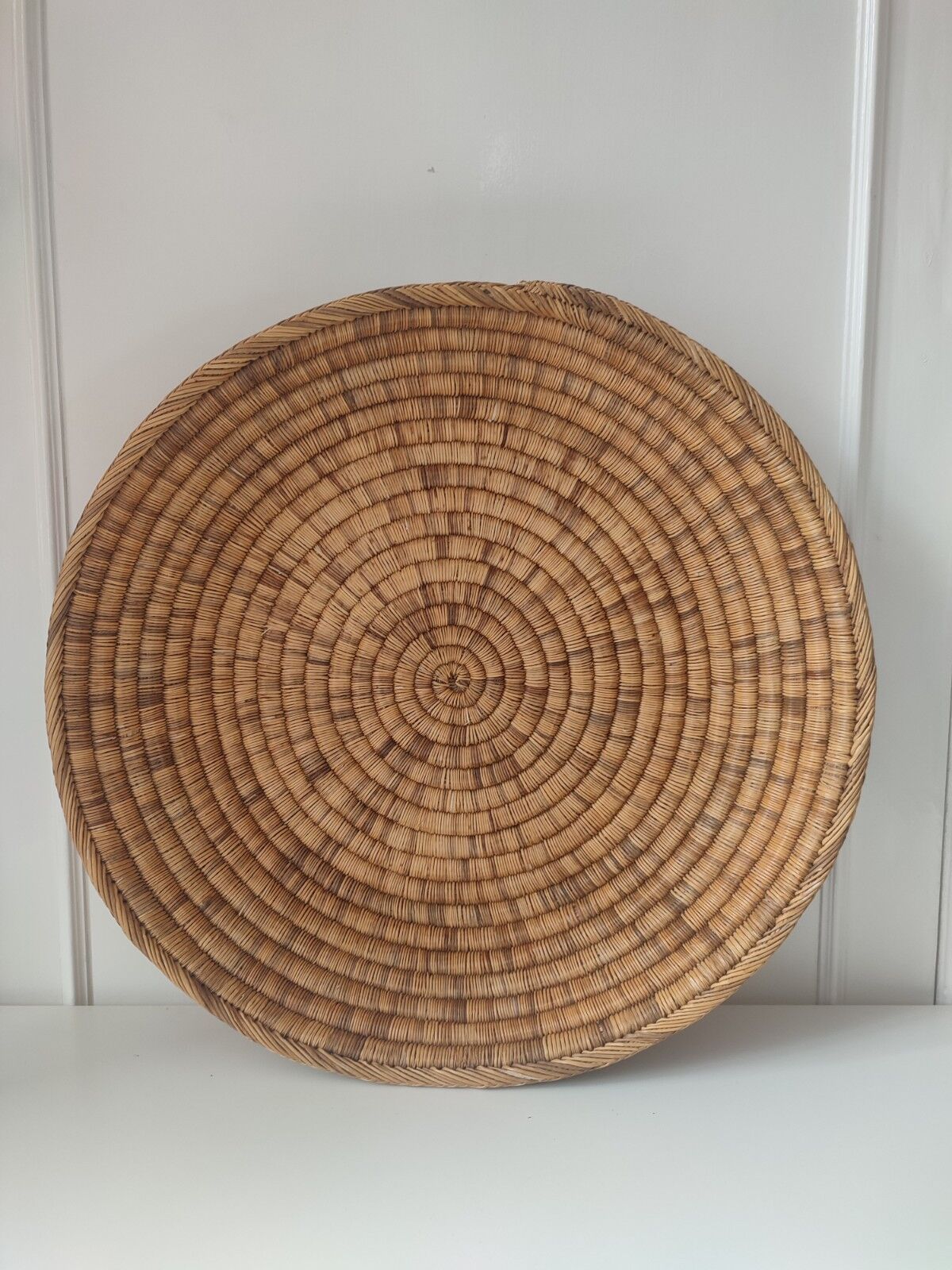 Ethnic plateau in woven palm leaf