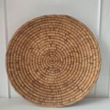 Ethnic plateau in woven palm leaf