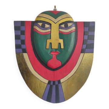Handcrafted decorative wall mask in painted wood.