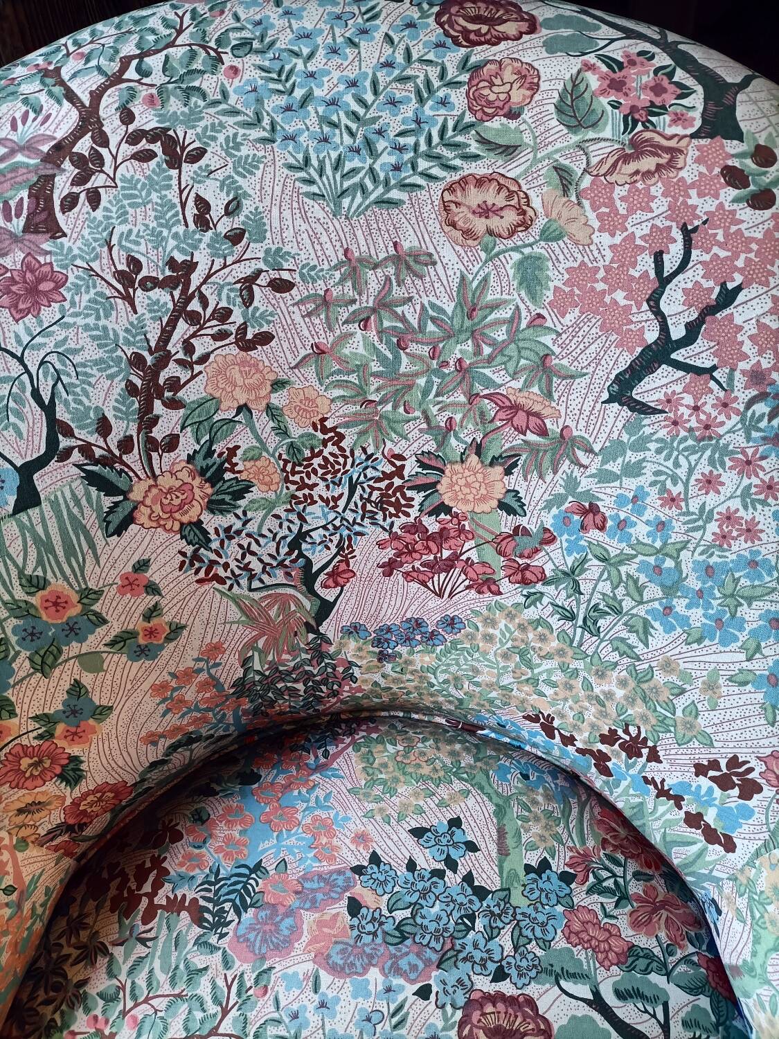 pair of toad armchairs in floral fabric.