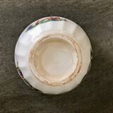 Old bowl decorated with a farmer and her cow