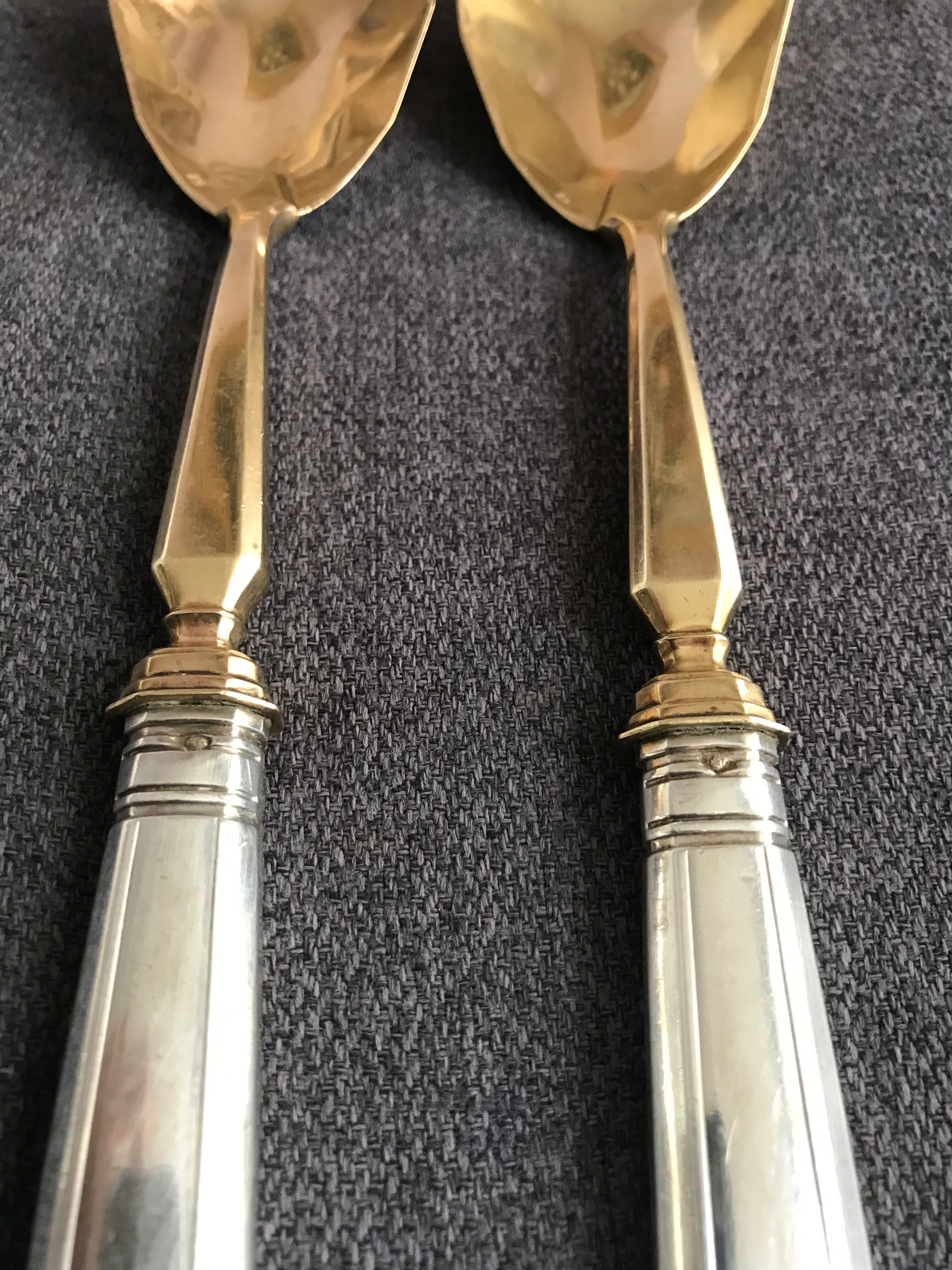 Pair of serving spoons in silver hallmark neck brace