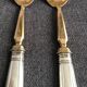 Pair of serving spoons in silver hallmark neck brace