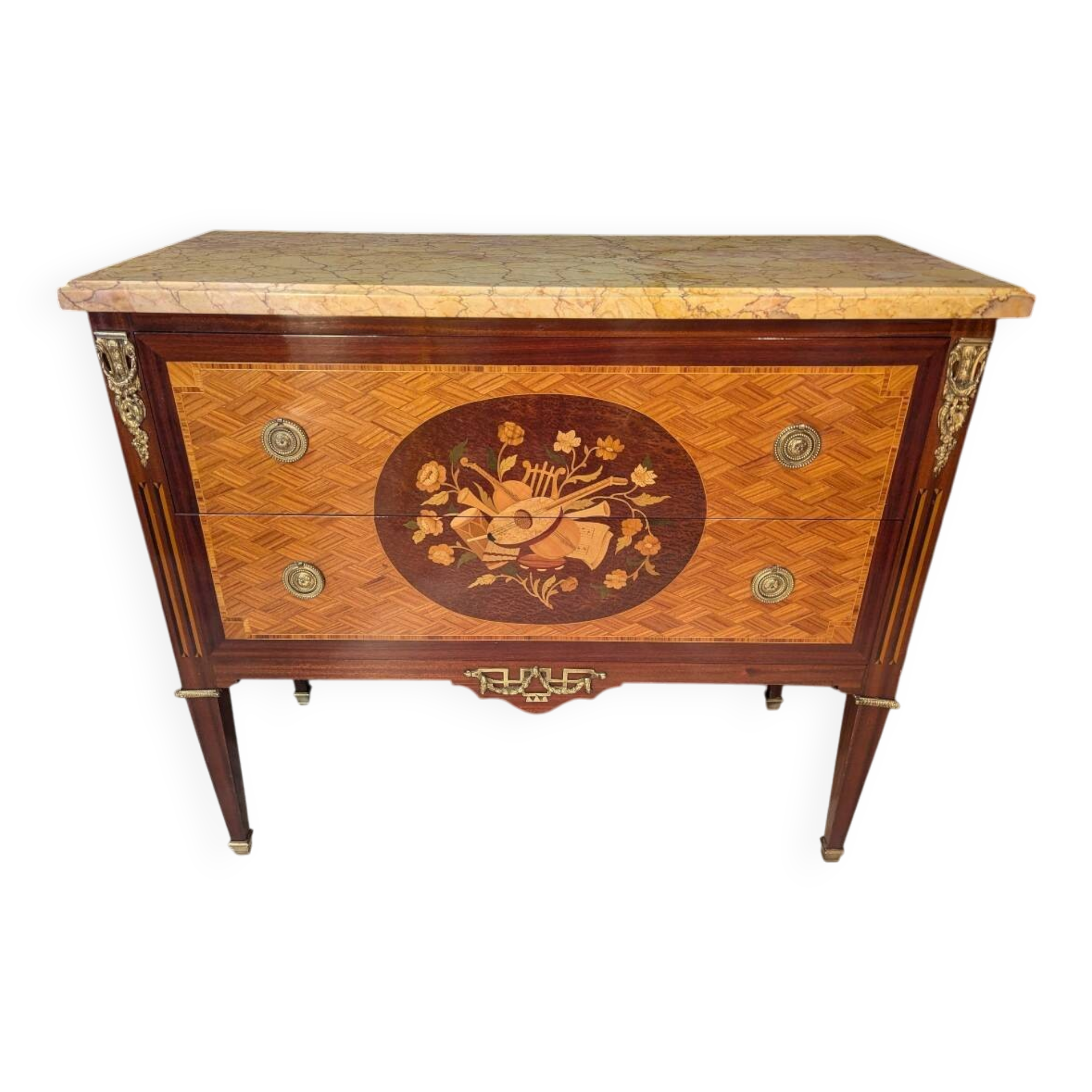 Louis XVI style commode inlaid with a decoration of instruments.