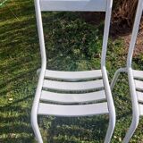 pair of white metal chairs, Tolix style