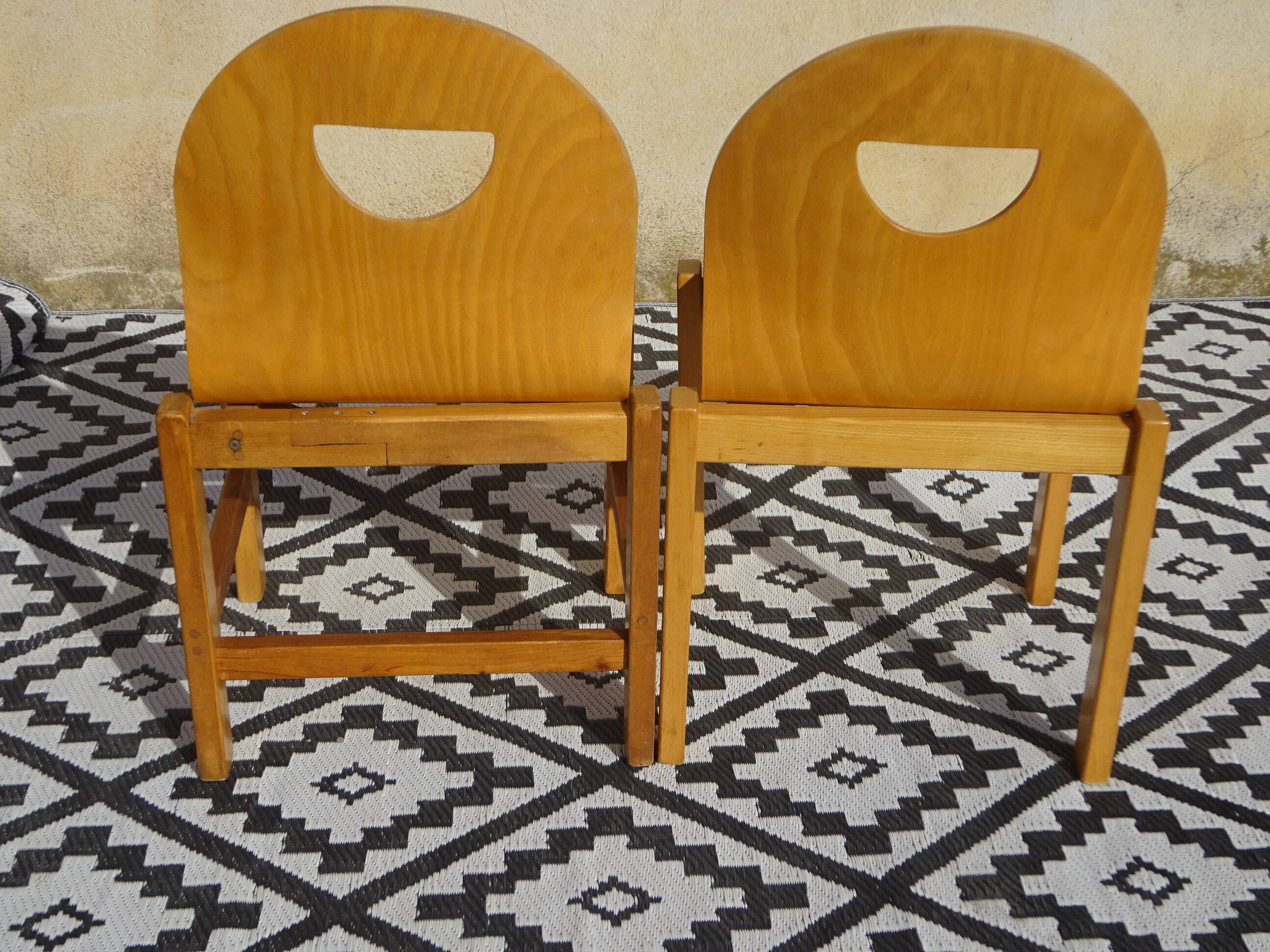 Pair of light wood chairs with post-formed seat and backrest.