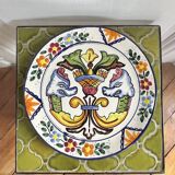Decorative ceramic plate with griffins