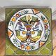 Decorative ceramic plate with griffins