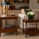 Pair of English mahogany side tables with sliding shelf.