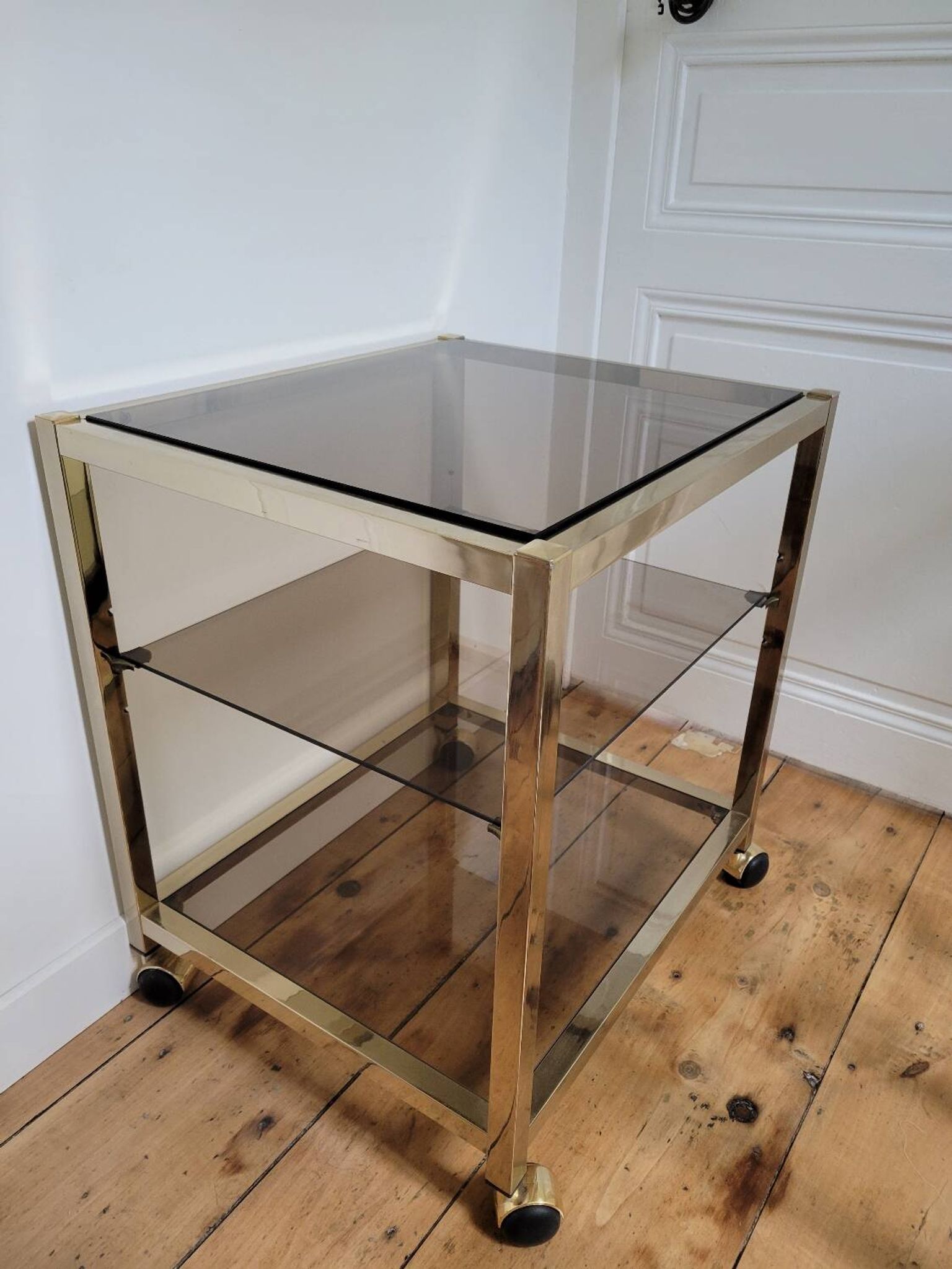 Gold metal and smoked glass serving trolley