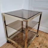 Desserte en métal doré et verre fumé