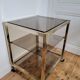 Gold metal and smoked glass serving trolley