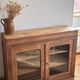 Narrow antique solid wood buffet - glass doors