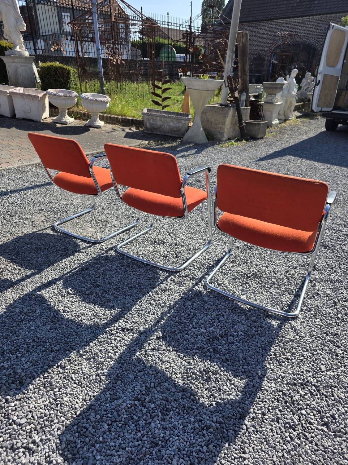 3 vintage chrome metal armchairs with orange fabric tops