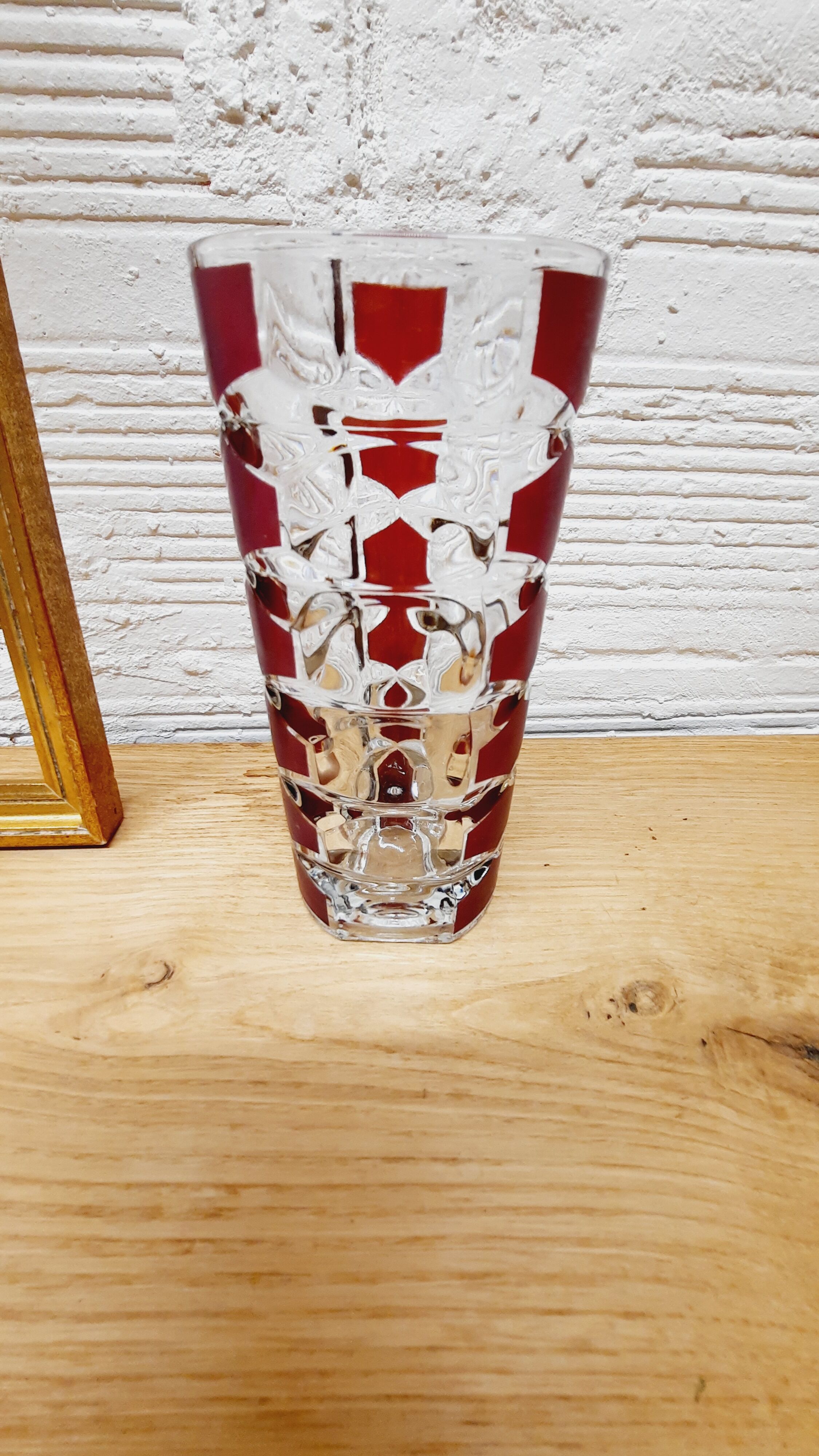Glass vase with colored facets