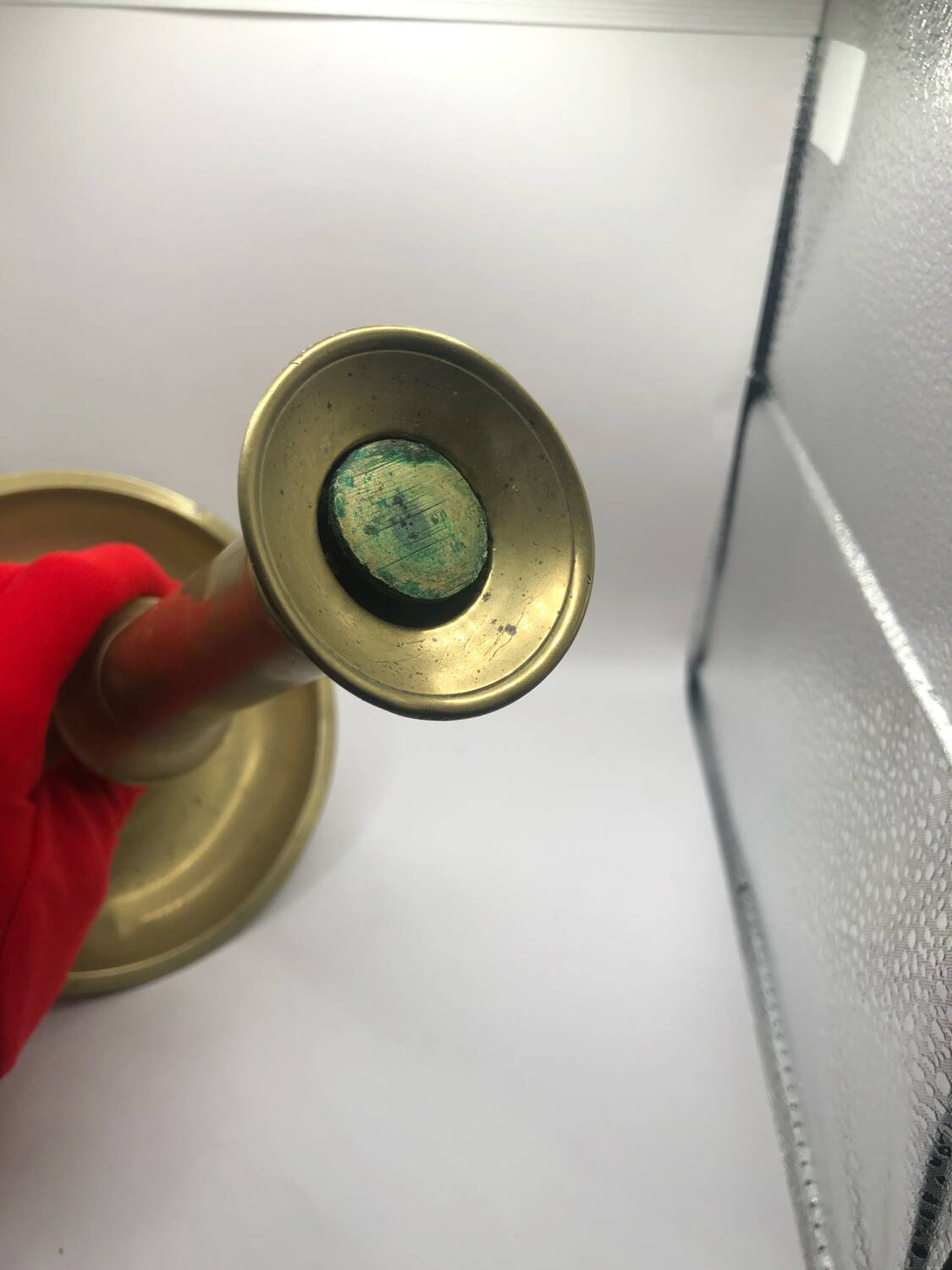 Candle holder with a pusher