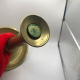 Candle holder with a pusher