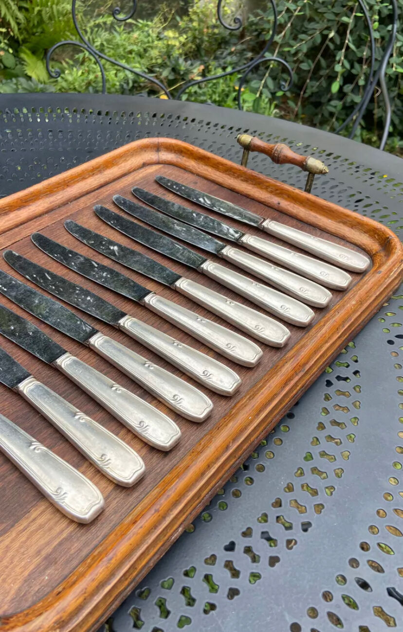 Set of 11 large silver metal knives