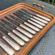 Set of 11 large silver metal knives
