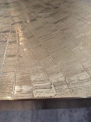 Engraved brass dining table attributed to Georges Mathias, 1975