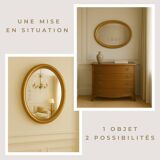 Large and elegant oval gilded mirror with its beveled glass