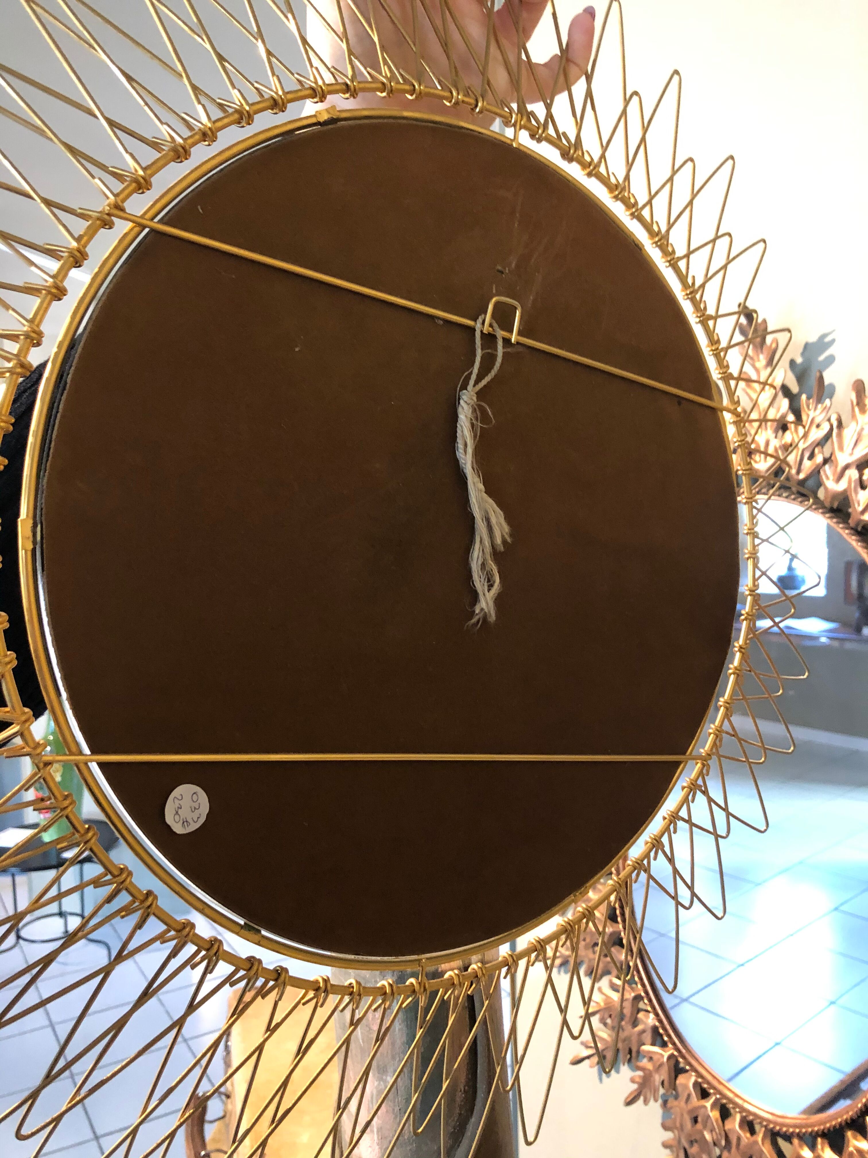 Golden brass sun mirror