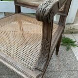 Wooden armchair with caning in Louis XVI style