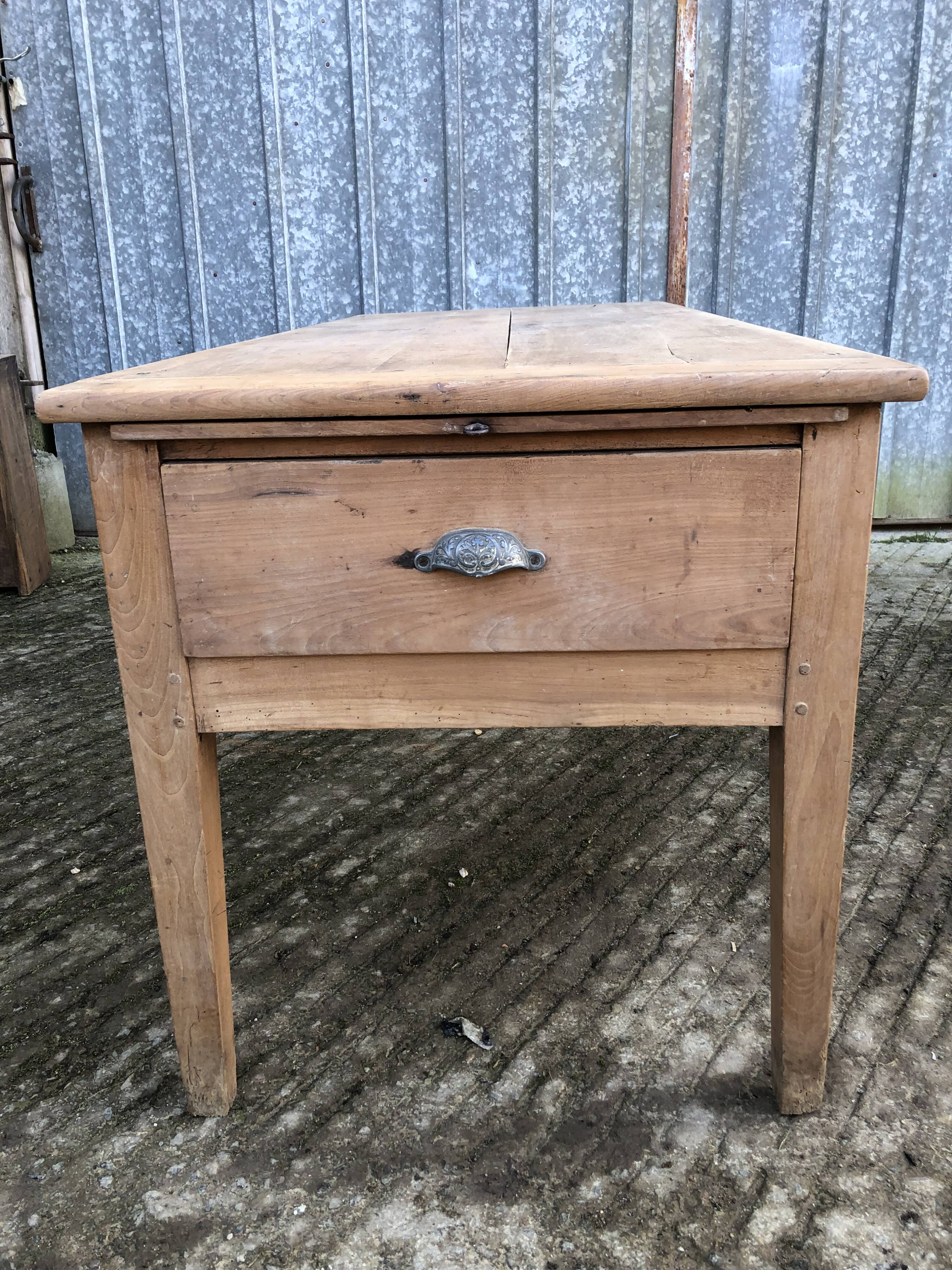 Antique solid cherry farmhouse table with 3 drawers and 1 pull out.
