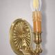 Pair of gilt bronze wall sconces in Directoire style by Lucien Gau.