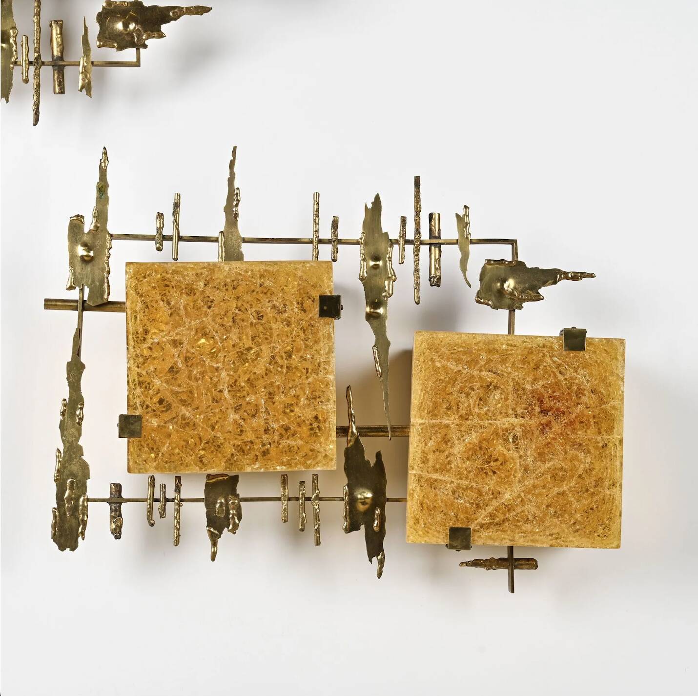 Pair of brutalist wall sconces in brass and fractal resin from the 1970s.
