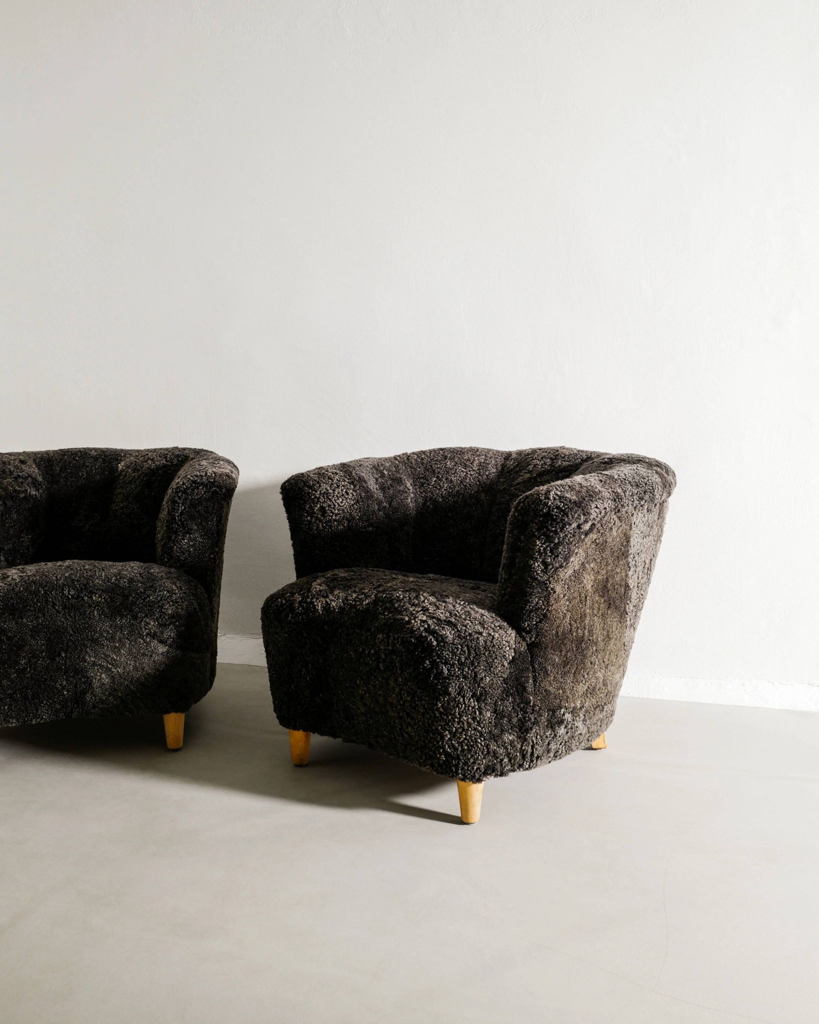 Pair of Swedish Curved Mid Century Modern Armchairs in Dark Sheepskin 1940s