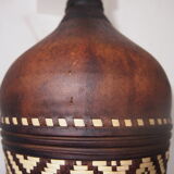 Old bottle in leather