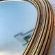 Large gold oval wall mirror