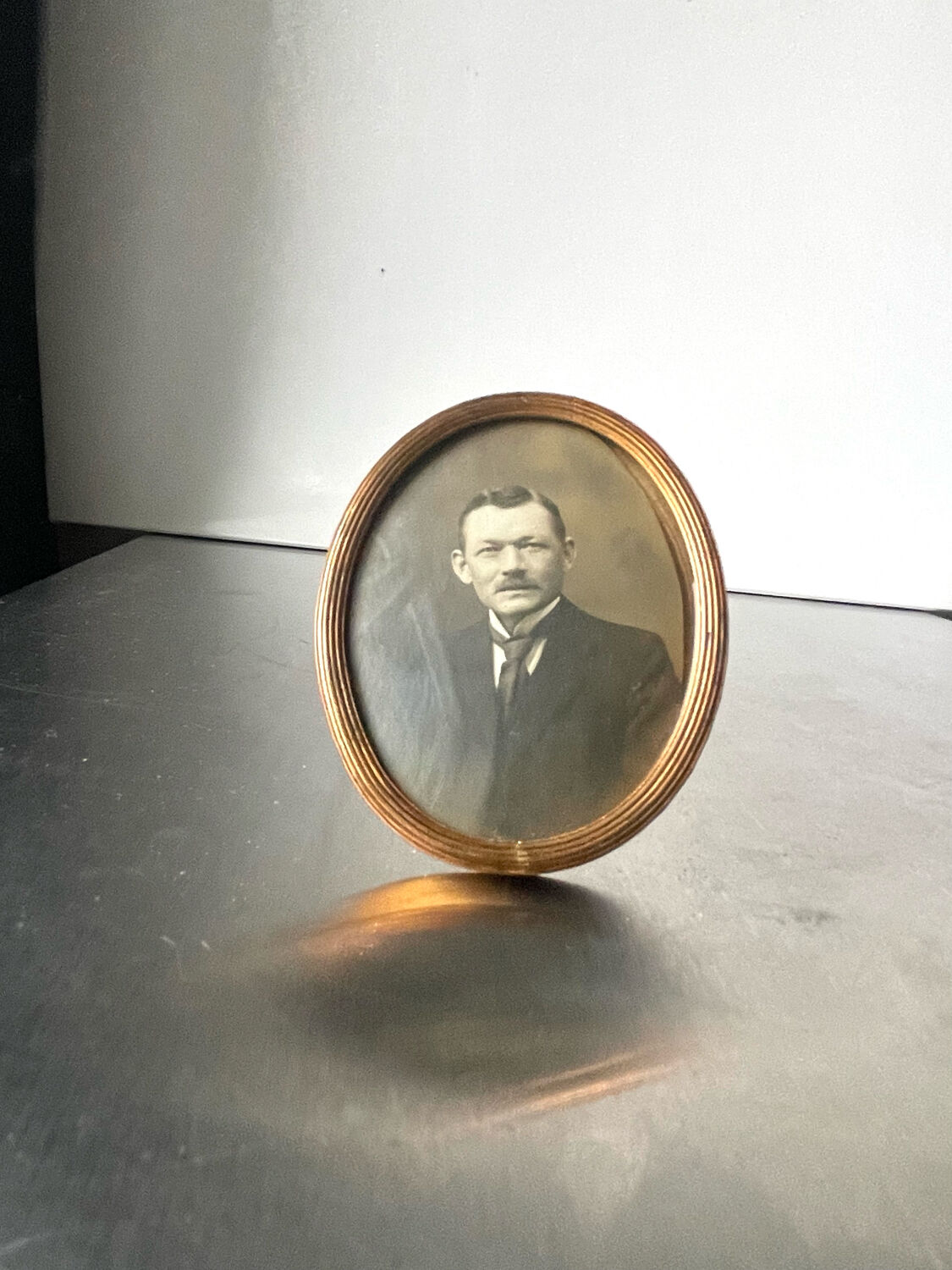 Metal gold colored oval picture frame brass