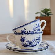 Old Lancaster cups and saucers in white earthenware with blue decoration.