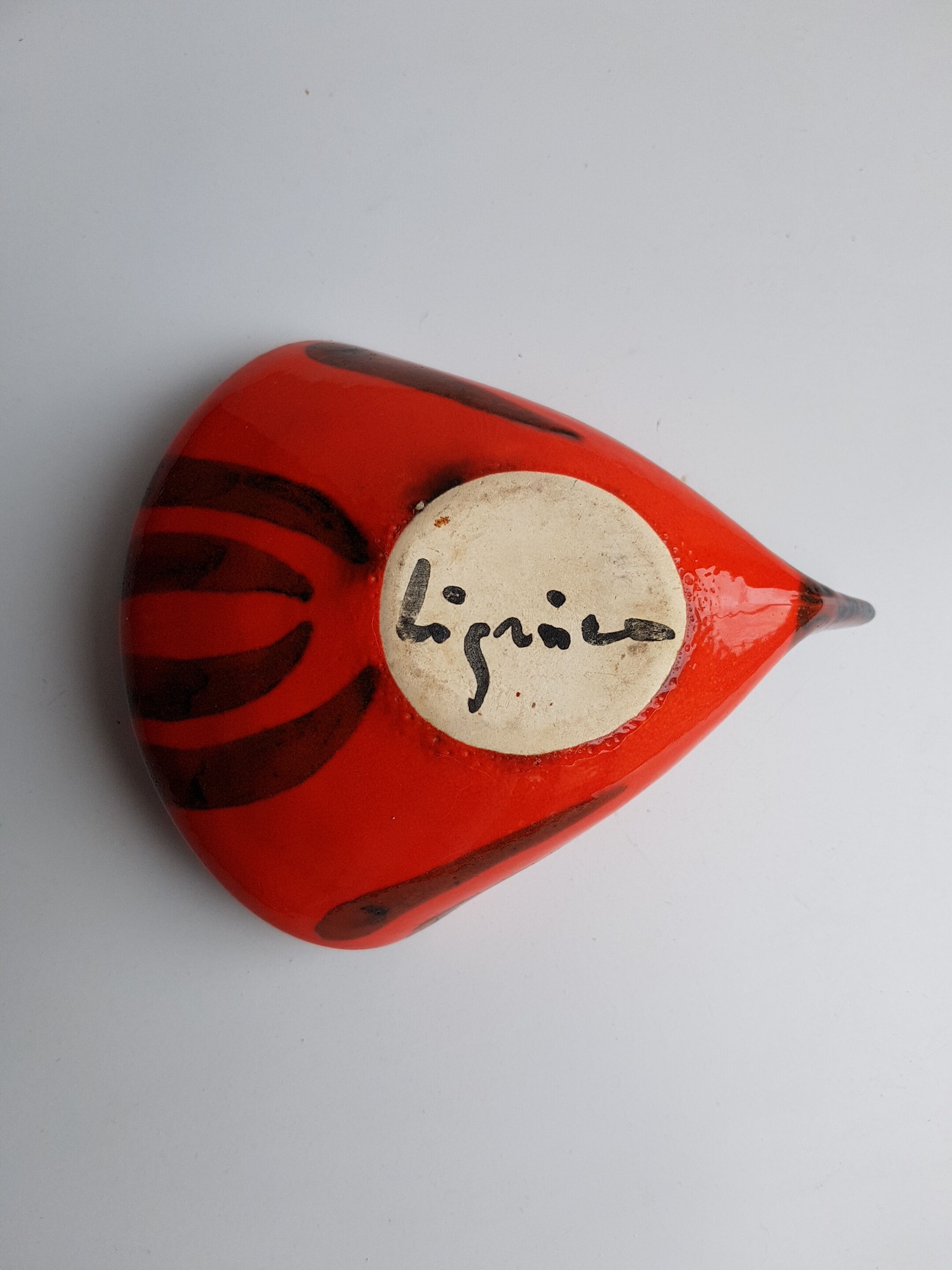 Empty orange enamelled pocket bird years 70