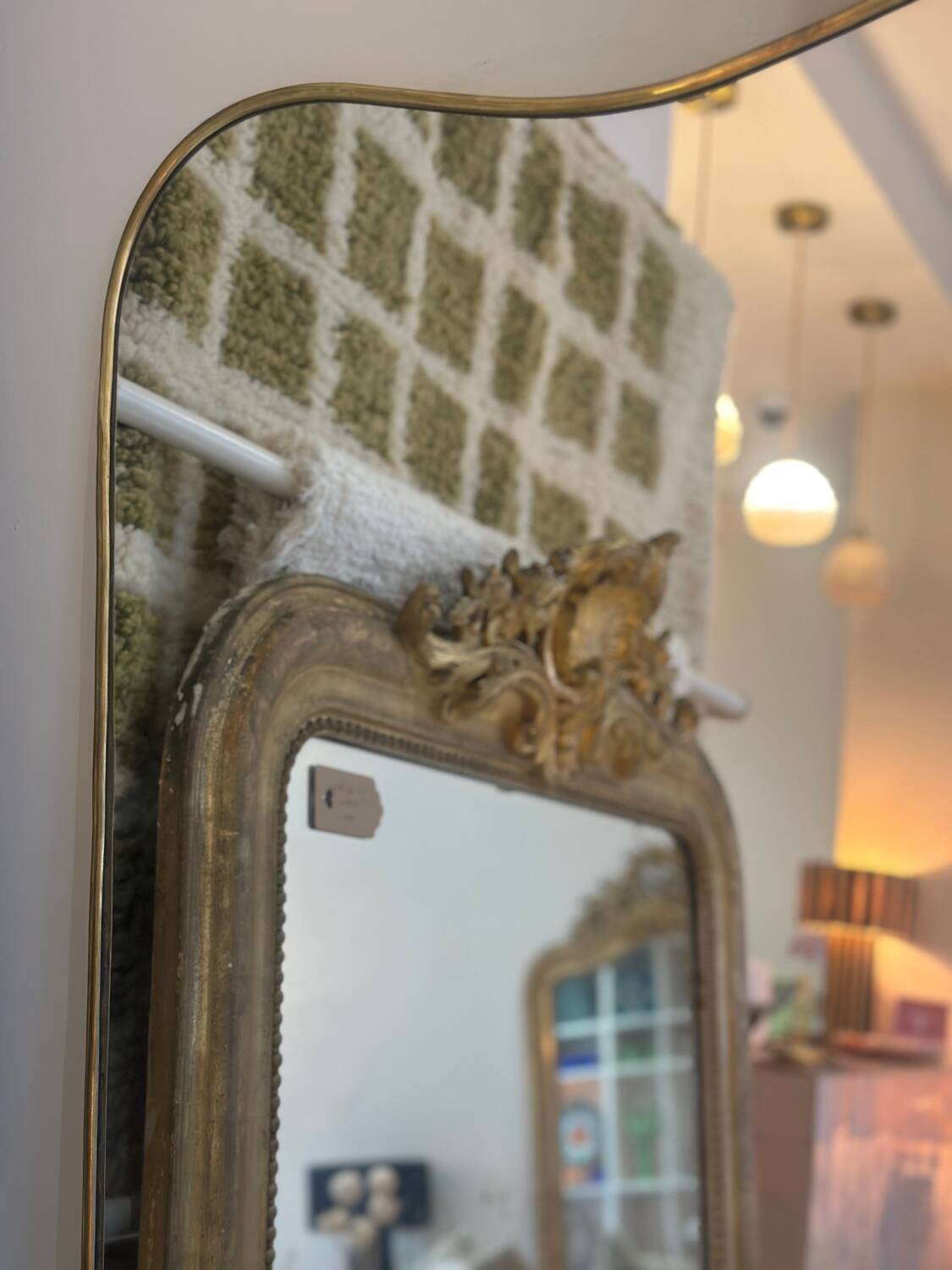 Long trapezoidal mirror in curved gilded brass, art deco modernist