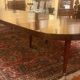 Extensible dining table from the Louis XVI period in mahogany with a banded top.