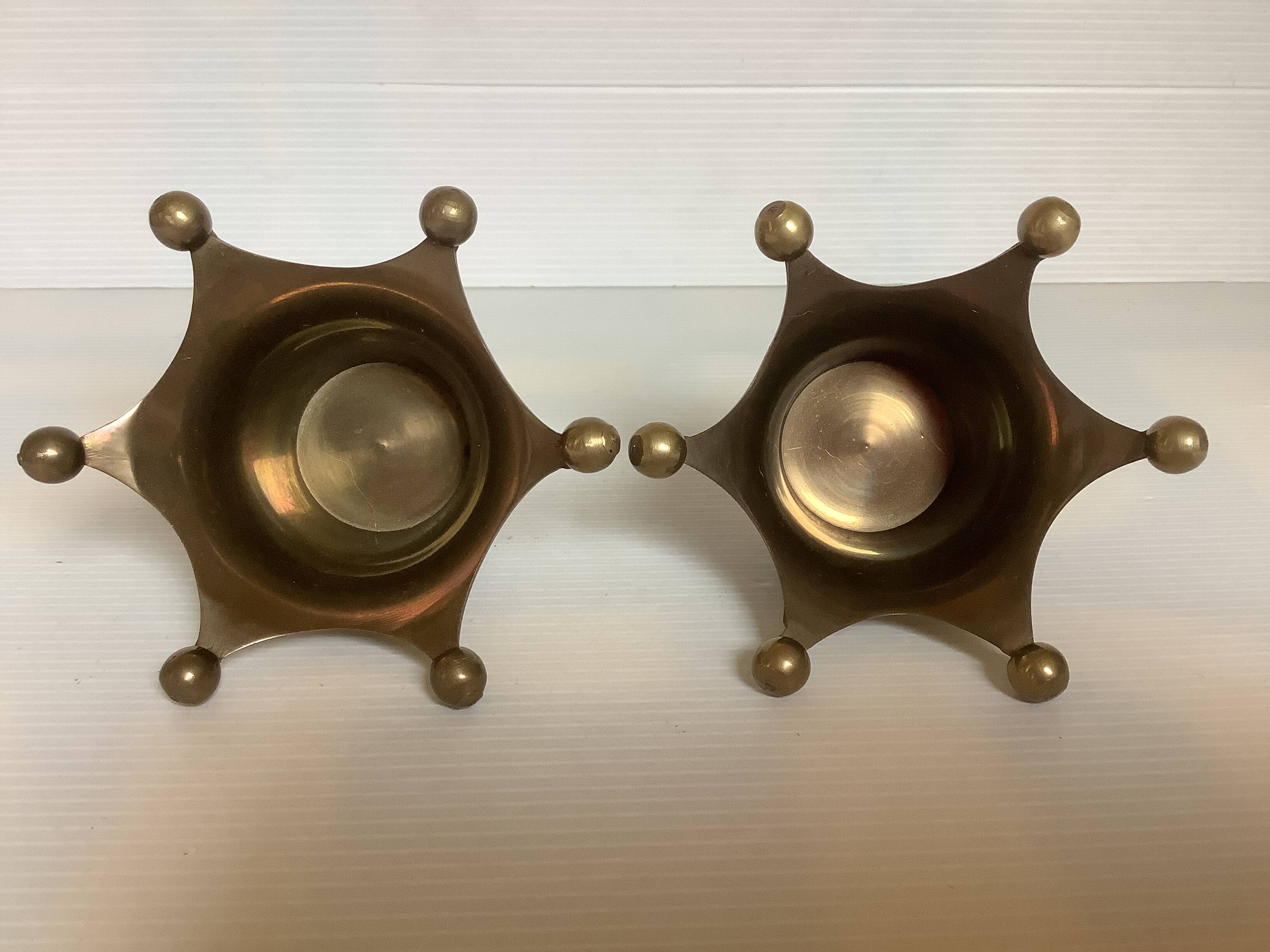 Pair of brass crown candlesticks