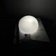 Small antique ceiling light or wall sconce with a frosted white glass half-moon.