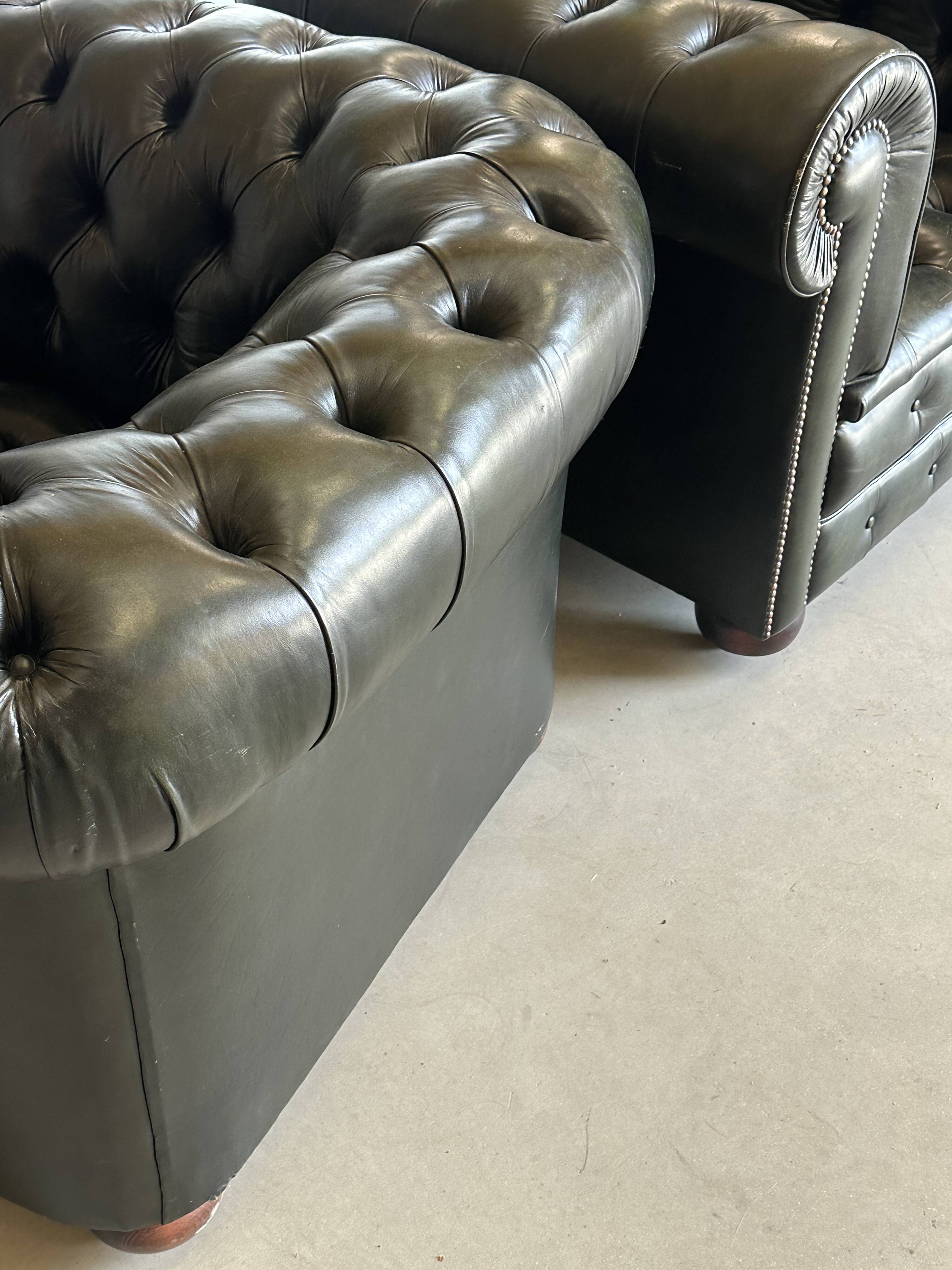 Title: Pair of vintage olive green leather Chesterfield armchairs